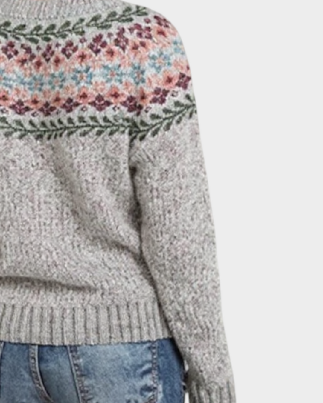 Luna Moda handmade grey knit sweater with a floral jacquard yoke pattern worn by a woman from the back view