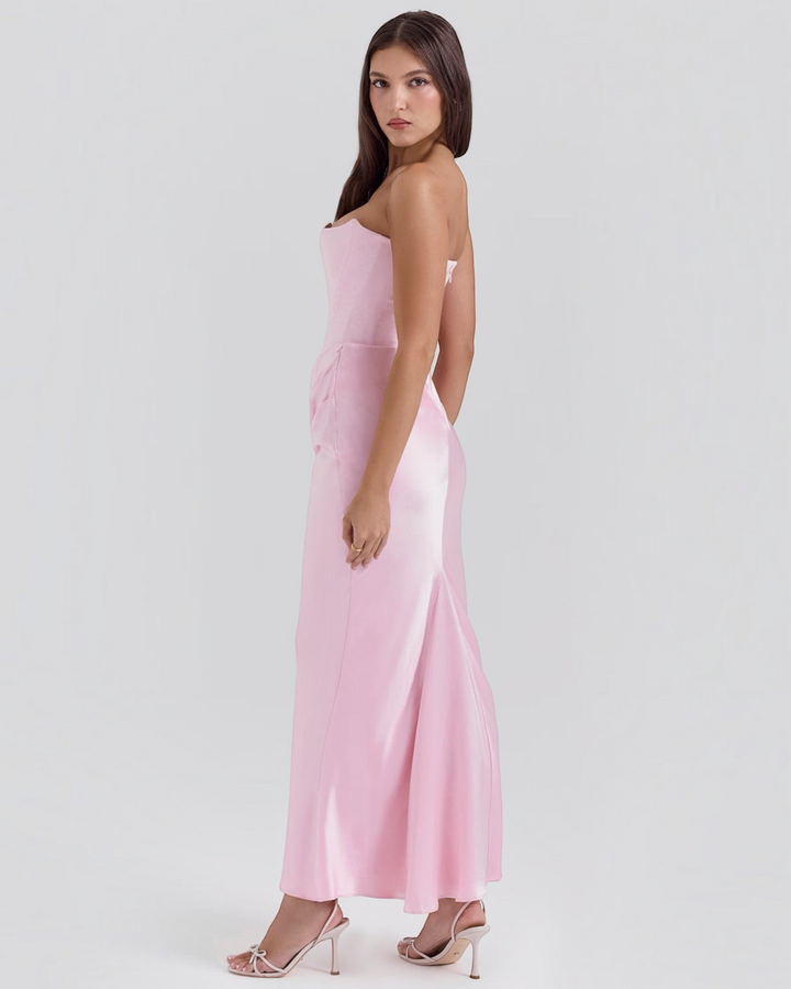 Luna Moda Leilani strapless pink evening gown with side draping and a structured bodice worn by a model