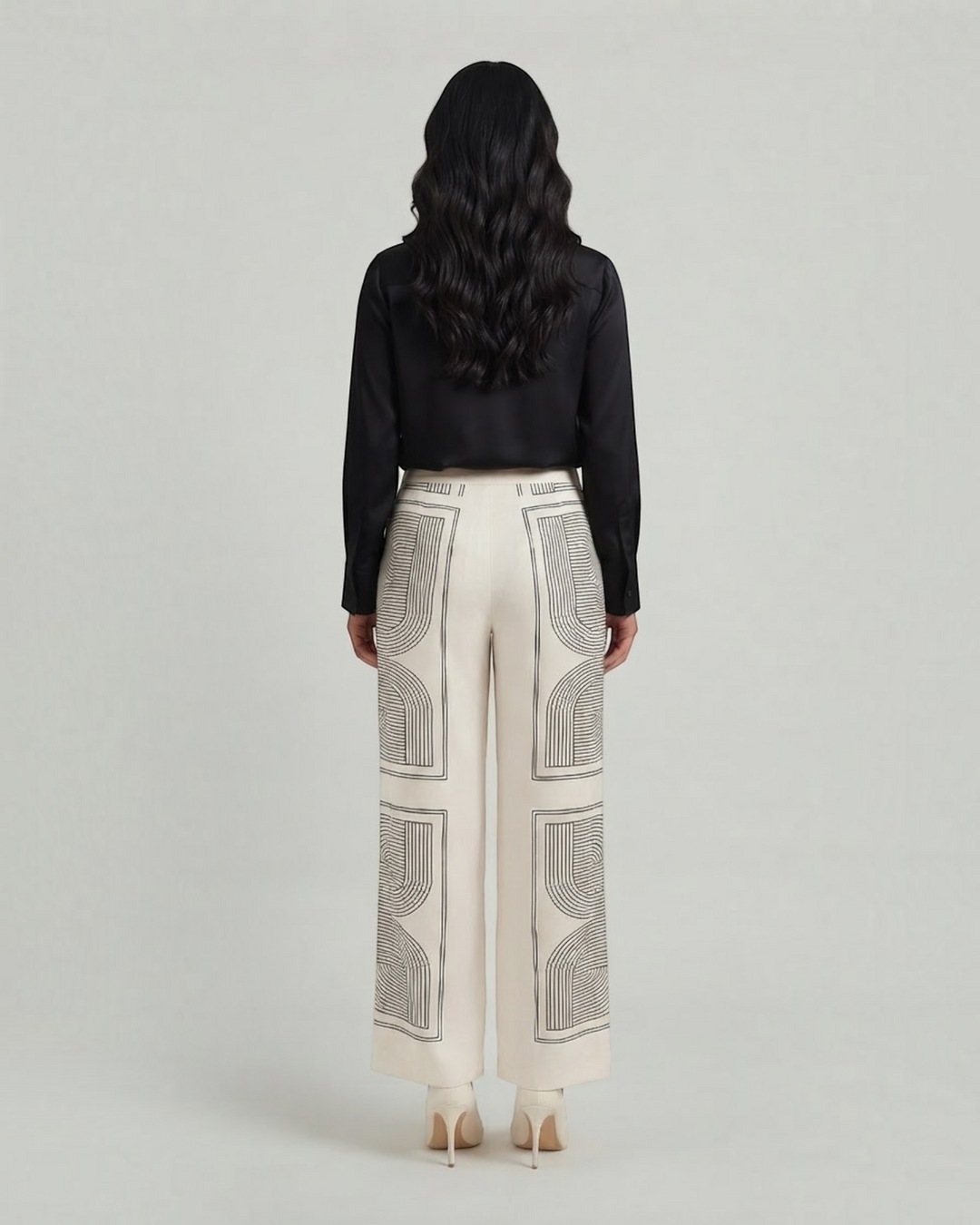 Luna Moda Demetra wide-leg trousers in cream with black geometric graphic print, back view on a model.