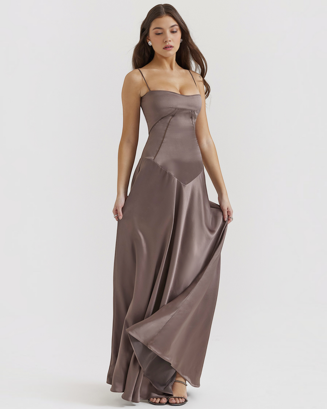 Luna Moda Noelle evening dress in taupe satin with a bustier bodice, thin straps, and a flowing floor-length skirt.
