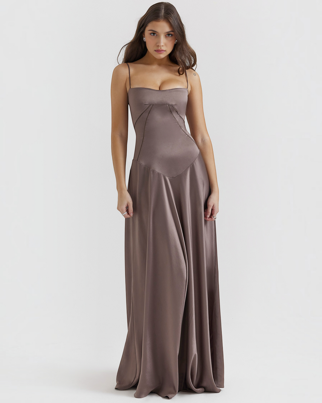 Luna Moda Noelle taupe satin bustier evening gown with thin straps and a flowing skirt worn by a model