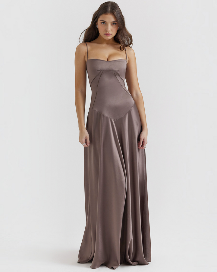 Luna Moda Noelle taupe satin bustier evening gown with thin straps and a flowing skirt worn by a model