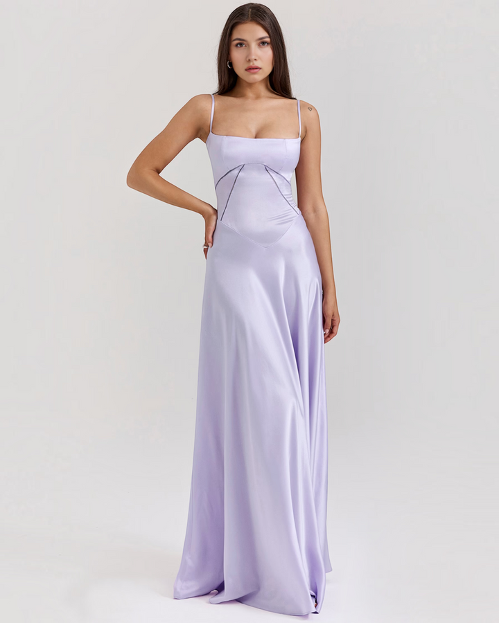 Luna Moda Noelle lavender satin bustier evening gown with spaghetti straps and a flowing skirt worn by a model