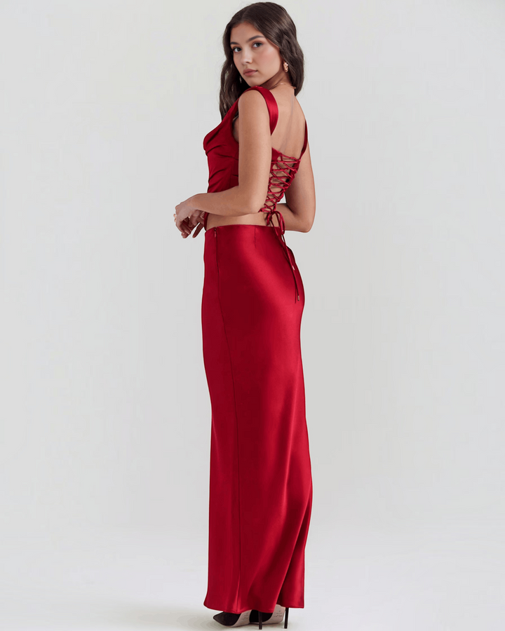 Luna Moda red satin corset top and matching maxi skirt with lace-up back detail worn by a model