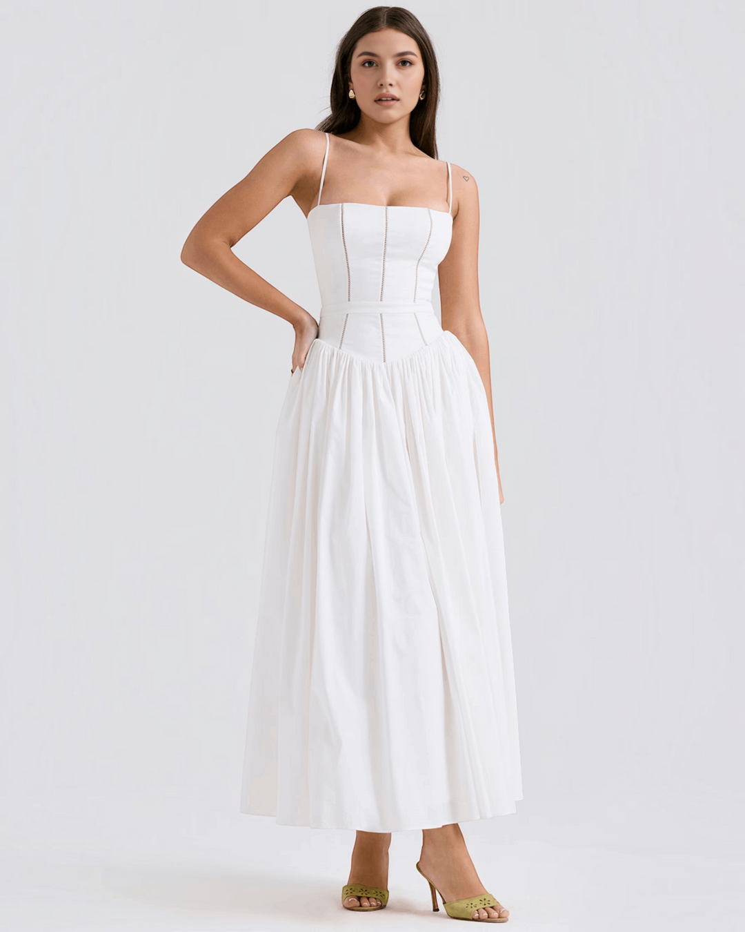 Luna Moda Violetta midi dress in white with a fitted bodice, spaghetti straps, and a full skirt on a model