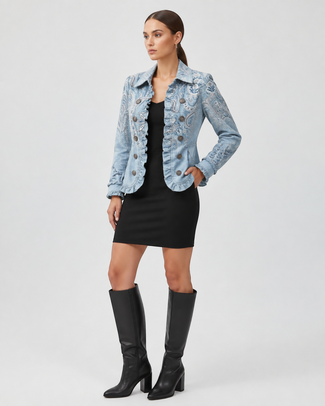 Luna Moda Emanuela jacket in light blue with paisley pattern, ruffle trim, and vintage buttons worn over black dress.