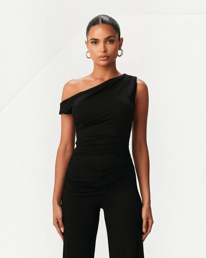 Luna Moda black asymmetric top with side ruching worn by a model for a sophisticated look