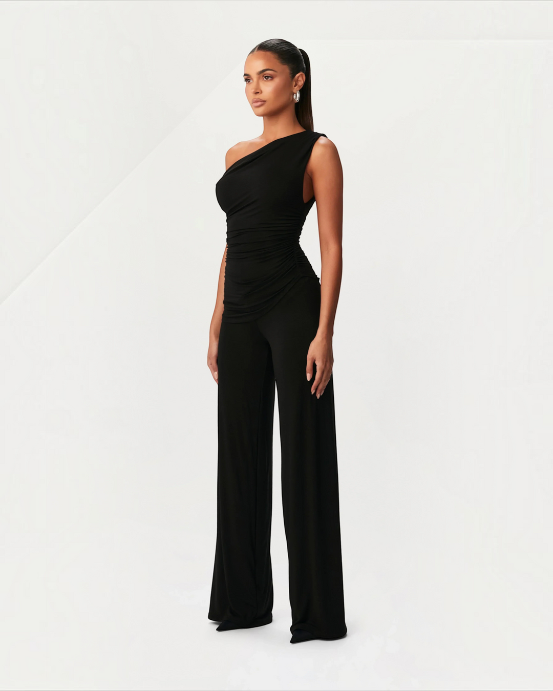 Luna Moda black asymmetric one-shoulder top and wide-leg trousers set with side ruching on a model