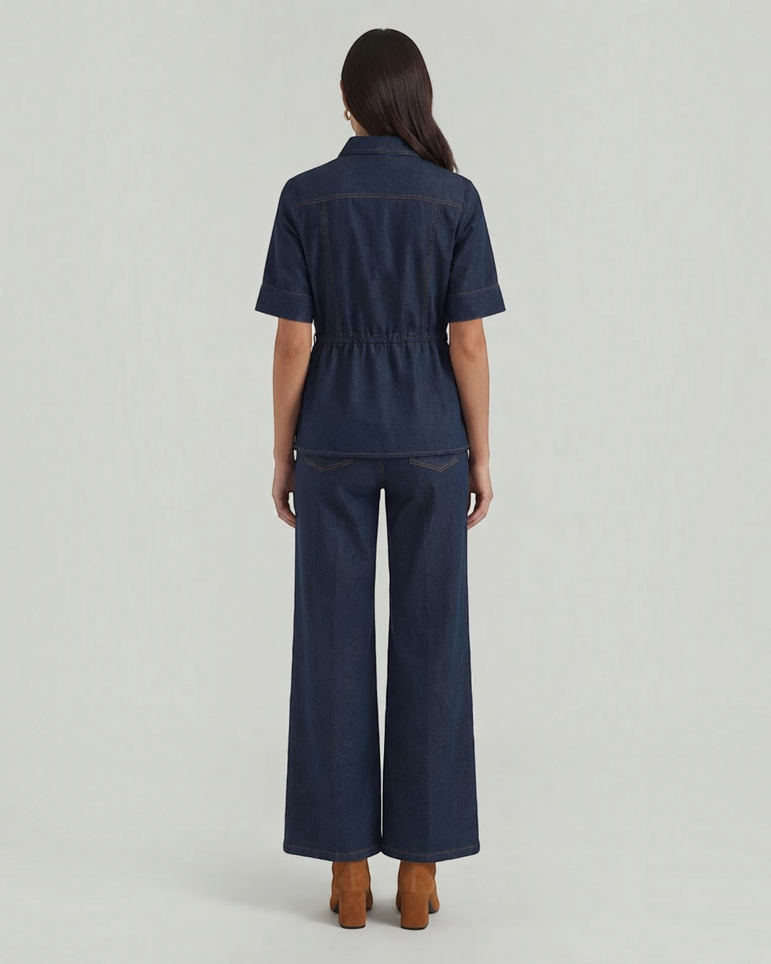 Back view of Luna Moda dark denim set featuring a short-sleeved top and wide-leg trousers on a model.