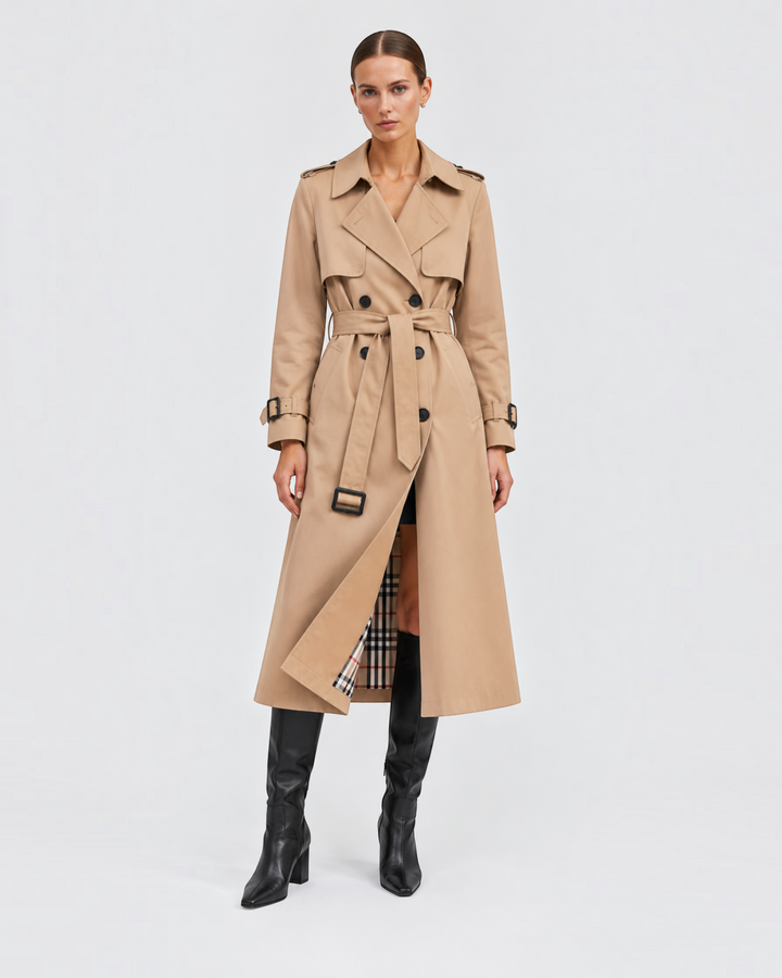 Luna Moda beige double-breasted trench coat with a belted waist and plaid lining worn by a model in black boots
