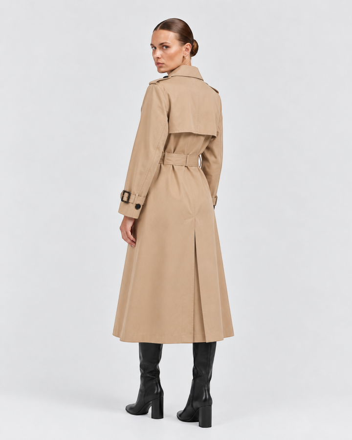 Luna Moda beige double-breasted trench coat with a waist belt worn by a model, back view