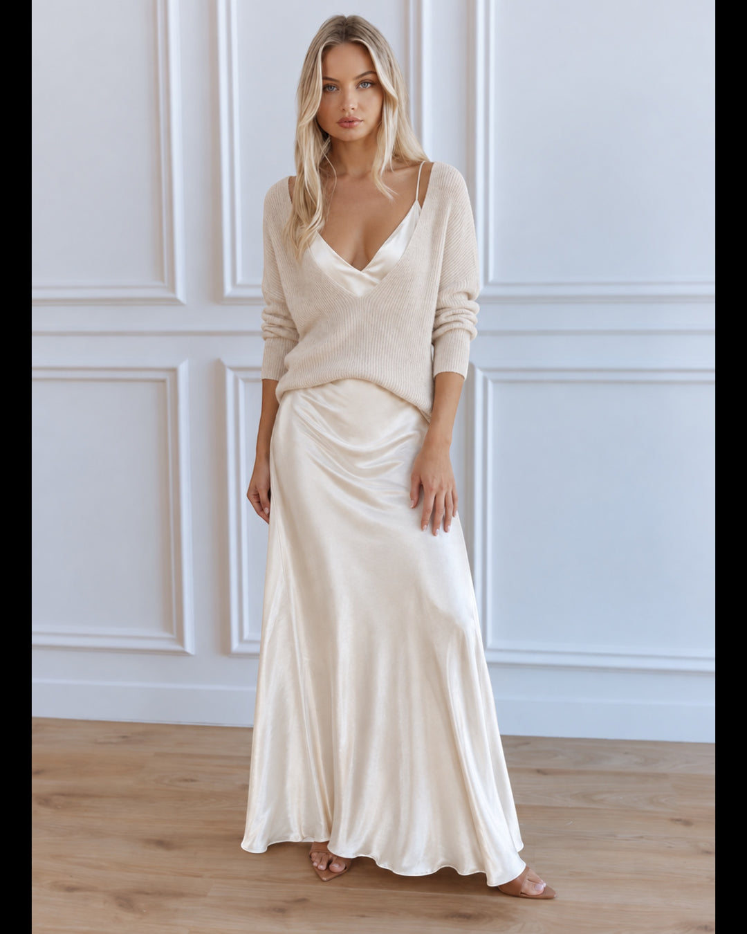 Luna Moda cream satin midi dress paired with a matching knit sweater worn by a blonde model in a bright studio