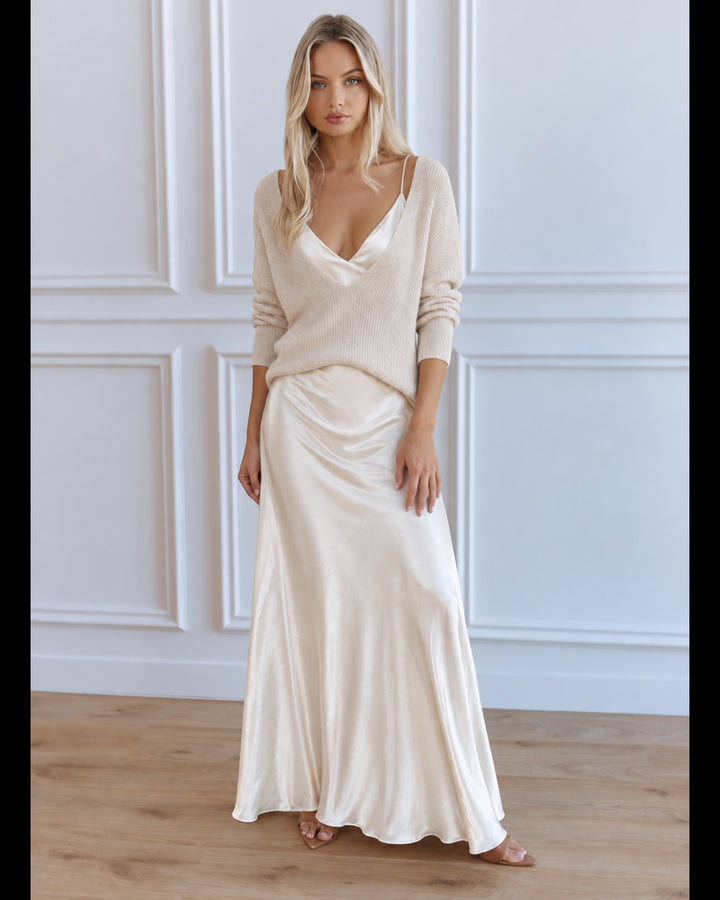Luna Moda cream satin midi dress paired with a matching knit sweater worn by a blonde model in a bright studio