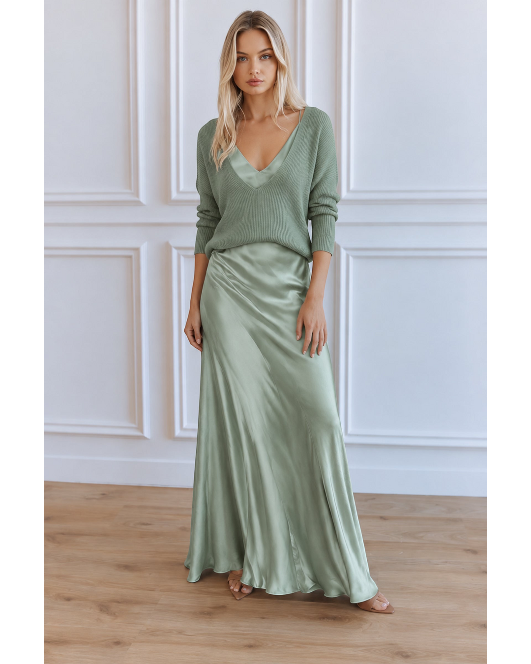 Luna Moda sage green satin midi dress paired with a matching V-neck sweater on a blonde model.