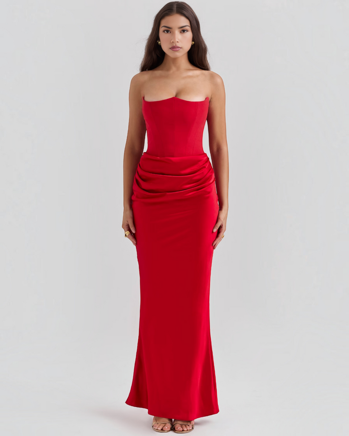 Luna Moda red strapless evening gown with a structured corset bodice and elegant side-draped waist detail
