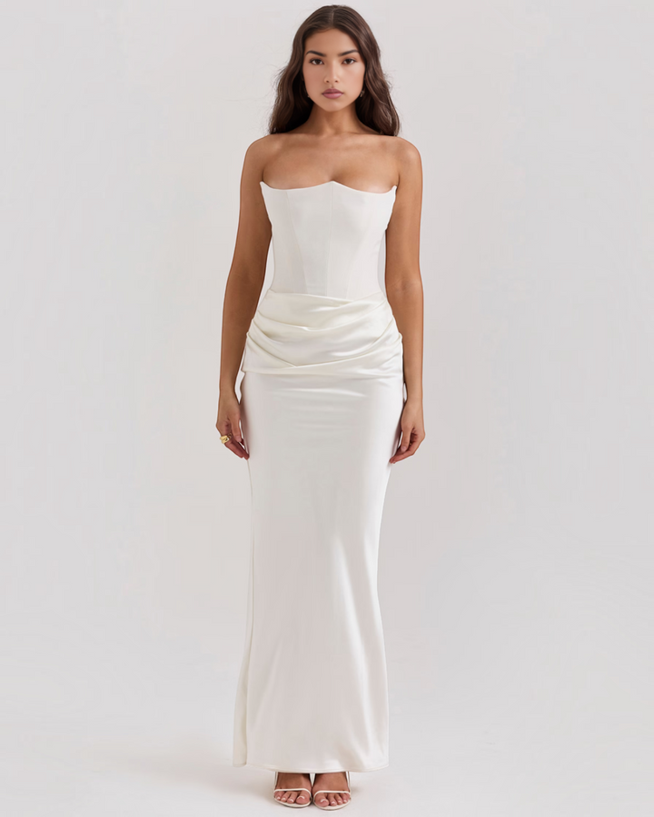 Luna Moda Leilani white strapless evening gown with a structured bodice and elegant side draping on a model