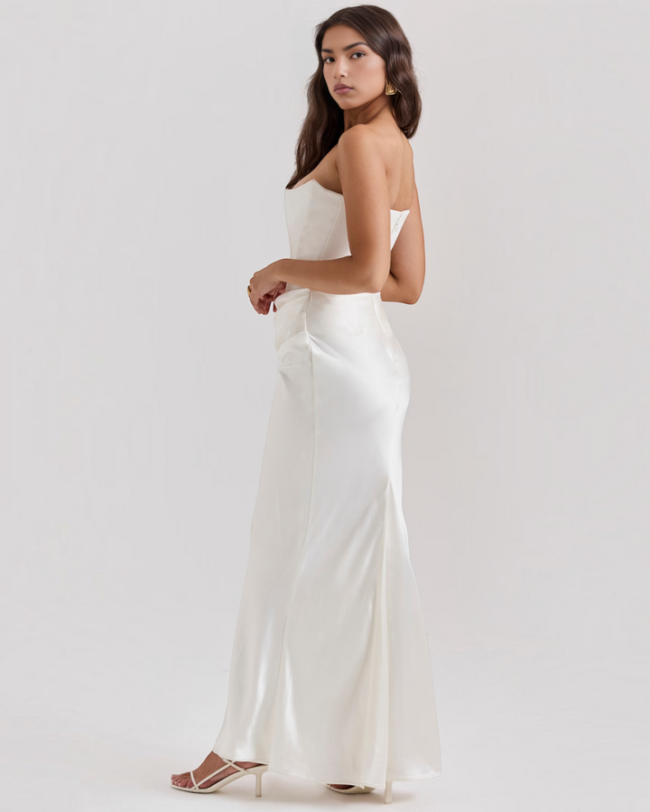Luna Moda Leilani white strapless evening gown with side draping and a sleek silhouette on a model