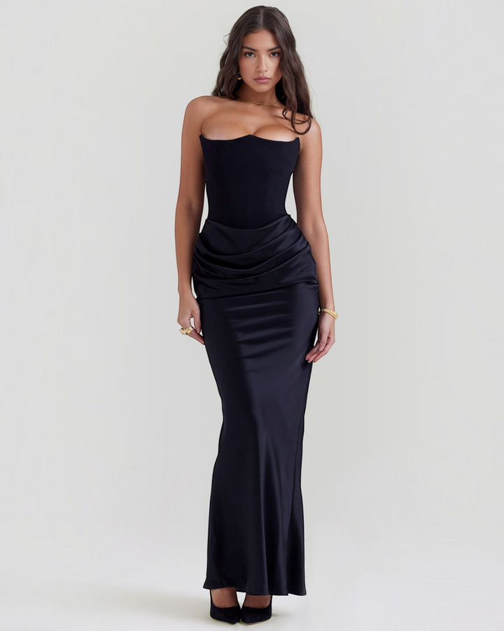 Luna Moda Leilani black strapless evening gown with a structured corset bodice and elegant side-draped waist detail.