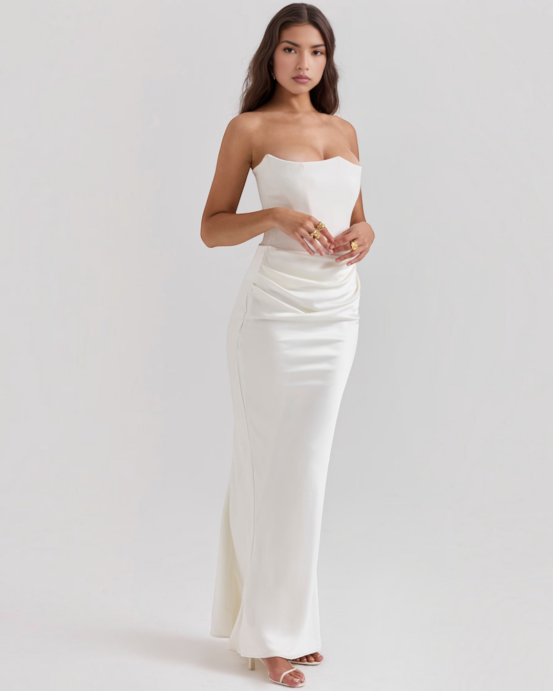 Luna Moda Leilani white strapless evening gown with a structured bodice and elegant side-draped waist detail.