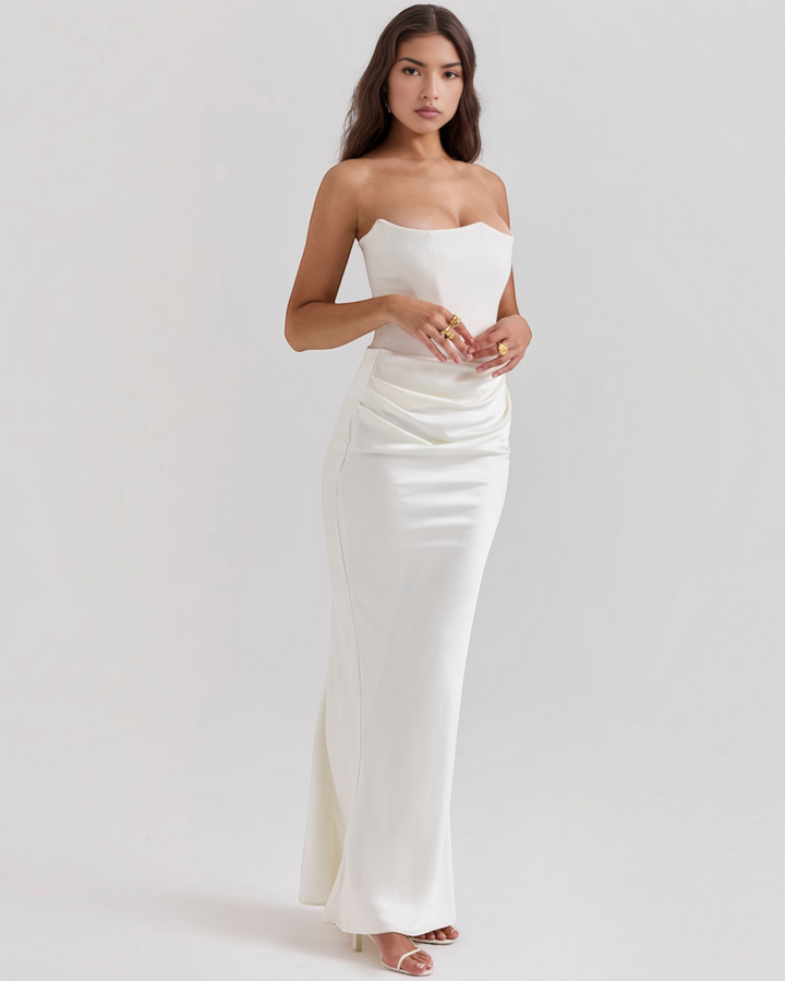 Luna Moda Leilani white strapless evening gown with a structured bodice and elegant side-draped waist detail.