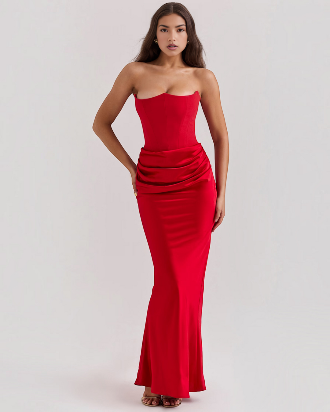Luna Moda Leilani red strapless evening gown with a structured corset bodice and elegant side-draped waist detail.