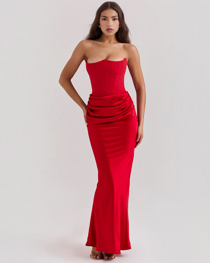 Luna Moda Leilani red strapless evening gown with a structured corset bodice and elegant side-draped waist detail.