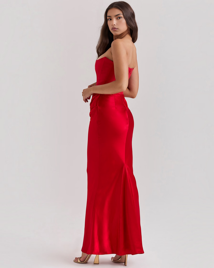 Luna Moda Leilani red strapless evening gown with side draping and a sleek, floor-length silhouette.