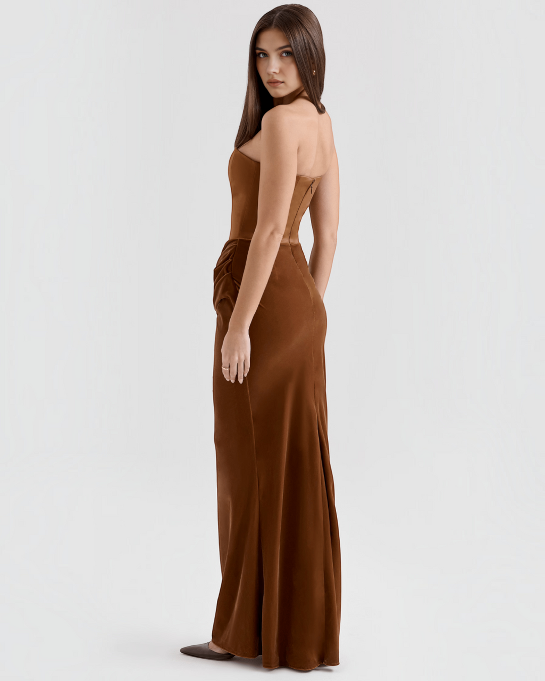 Luna Moda brown satin strapless evening gown with a draped waist worn by a model against a plain background