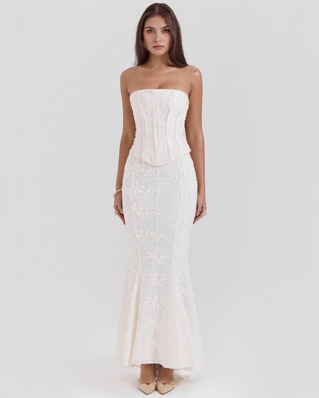 Luna Moda ivory floral embroidered corset dress with a figure-flattering silhouette, worn by a model.