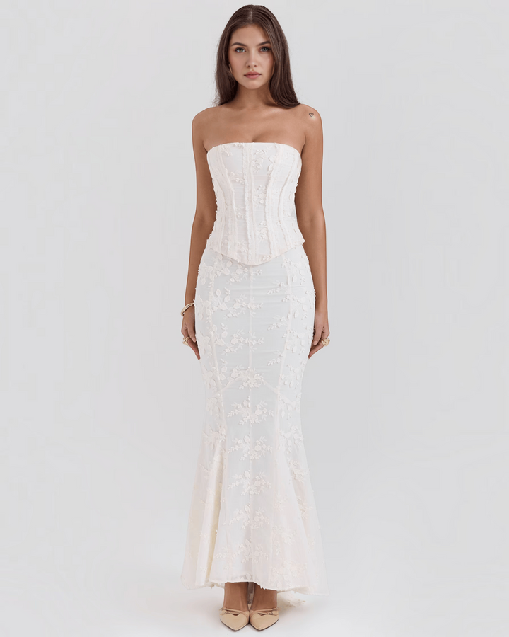 Luna Moda ivory floral embroidered corset dress with a figure-flattering silhouette, worn by a model.
