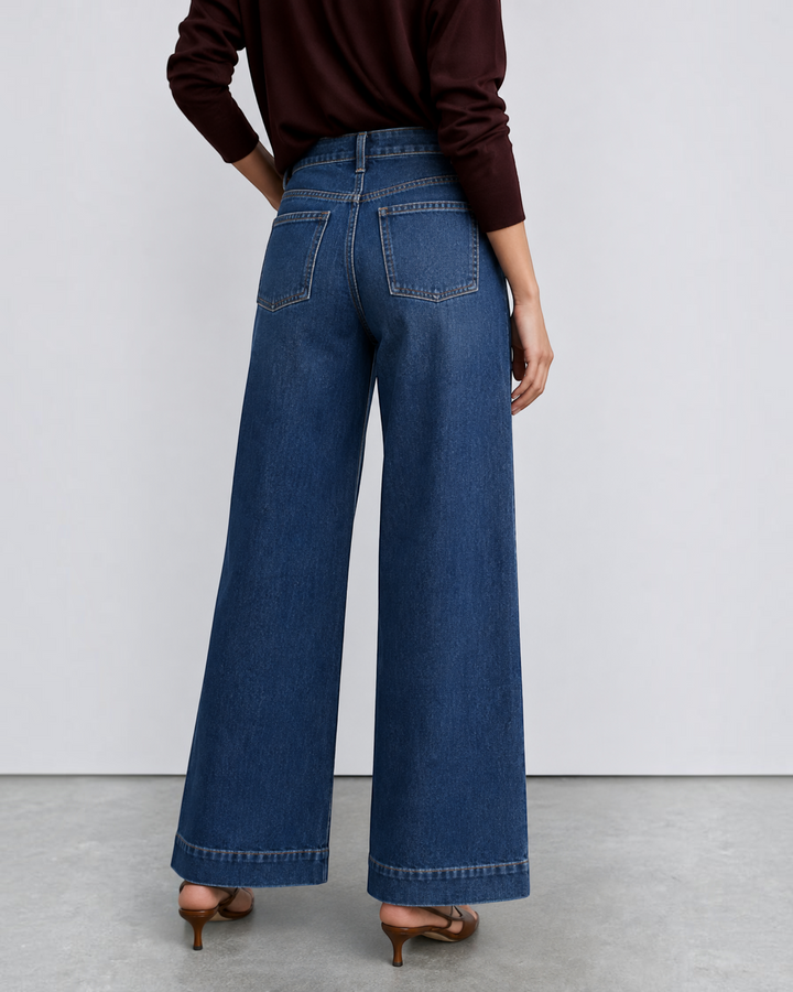 Luna Moda high-waisted dark wash denim jeans with a wide-leg retro fit worn by a model from the back view