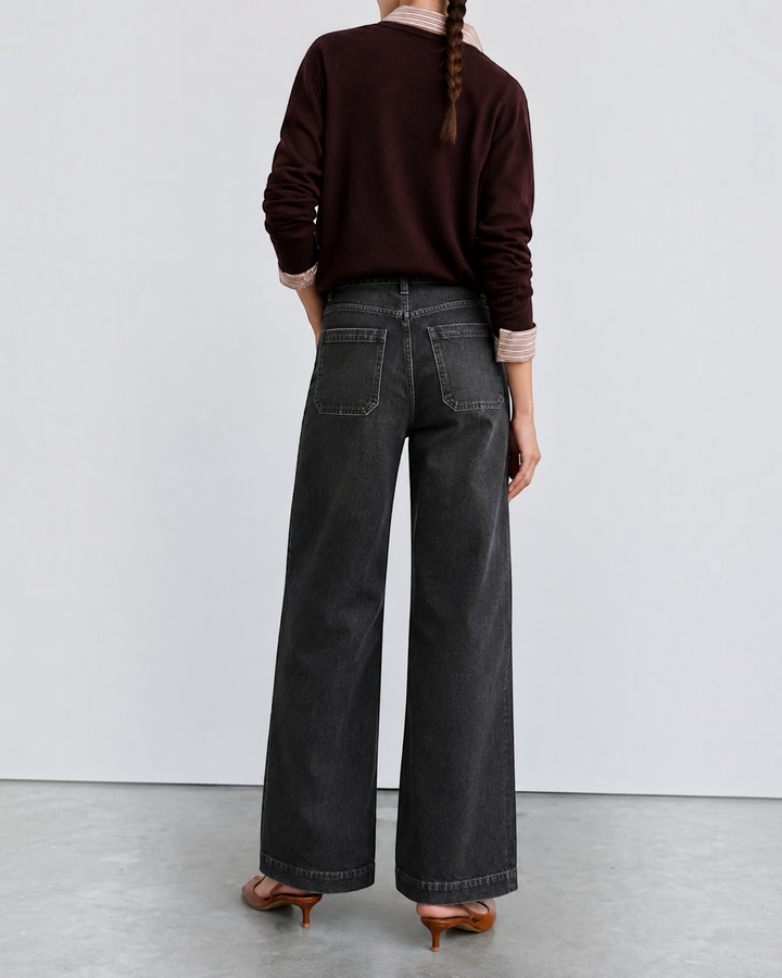 Luna Moda high-waisted dark wash retro jeans worn by a woman with a burgundy sweater, back view.