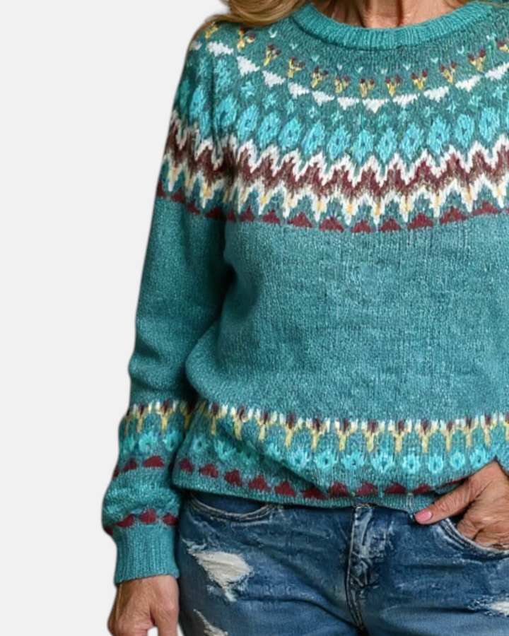 Luna Moda Barbara handmade teal knit sweater featuring a traditional Nordic pattern in white, yellow, and burgundy.