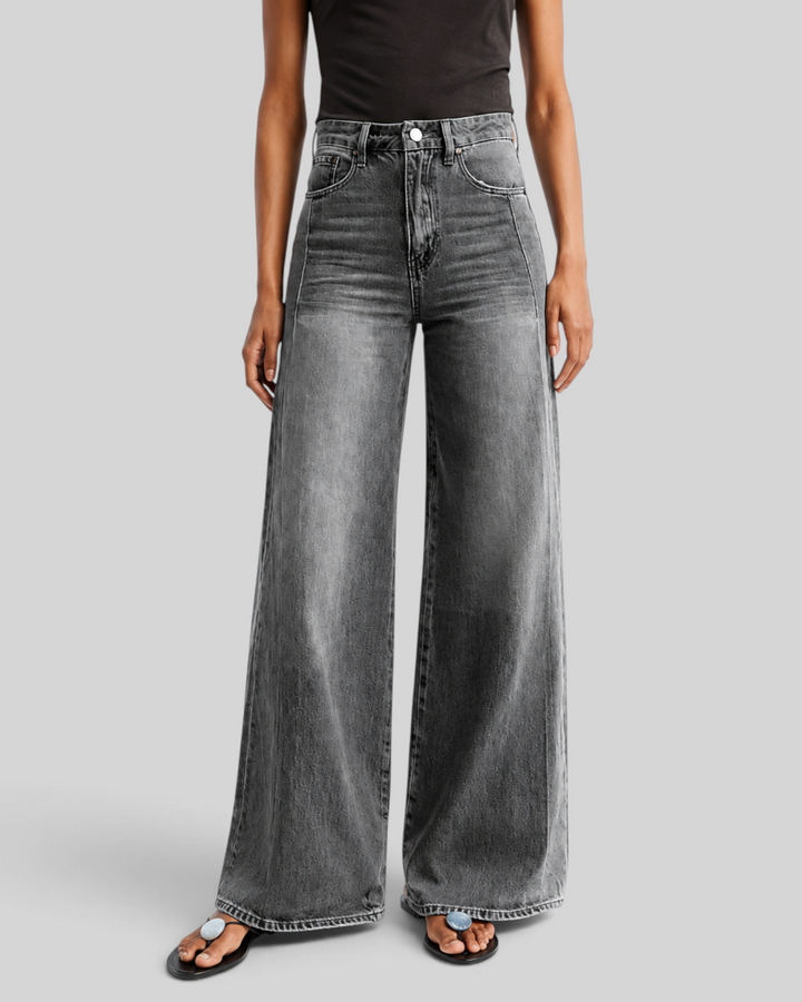 Luna Moda high-waisted wide-leg jeans in washed grey denim worn by a model with a black top