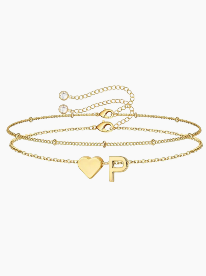 Luna Moda gold double chain bracelet featuring a minimalist heart charm and a personalized letter initial