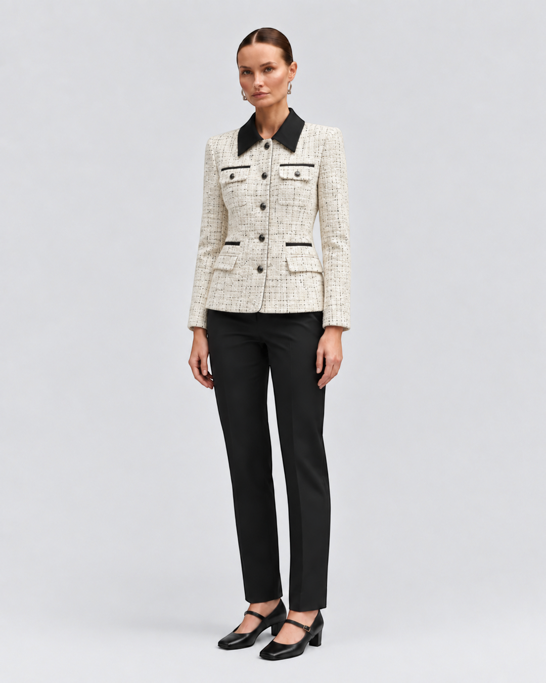 Model wearing a Luna Moda cream textured tweed jacket with a black contrast collar and button-down front.