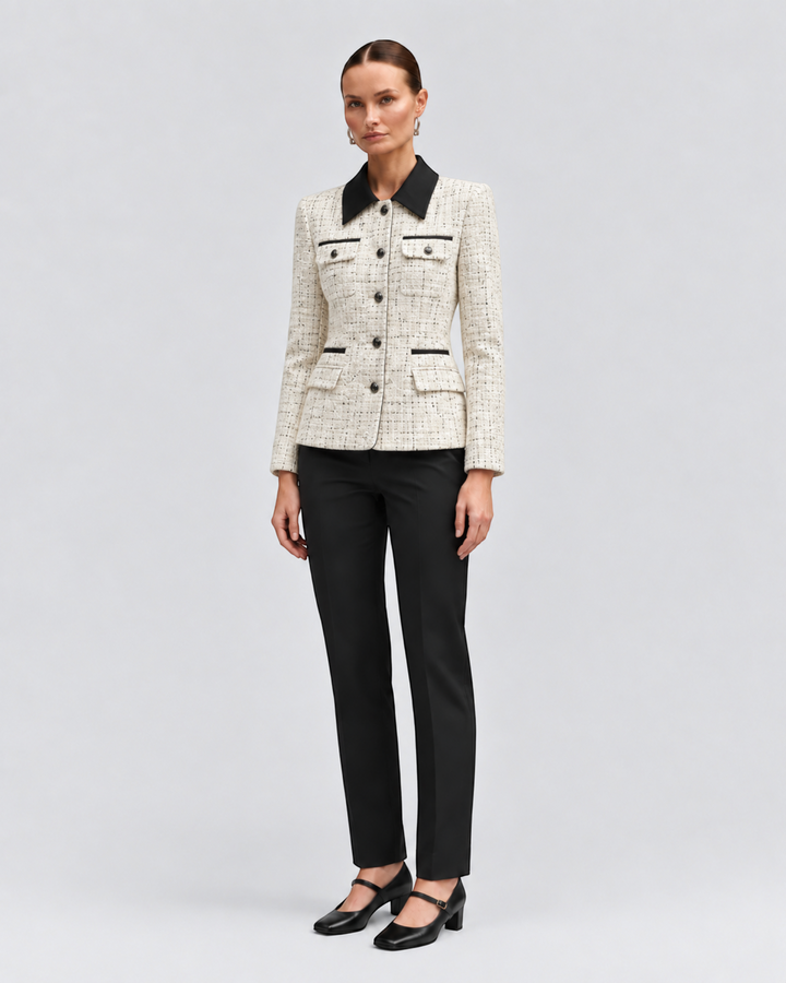 Model wearing a Luna Moda cream textured tweed jacket with a black contrast collar and button-down front.