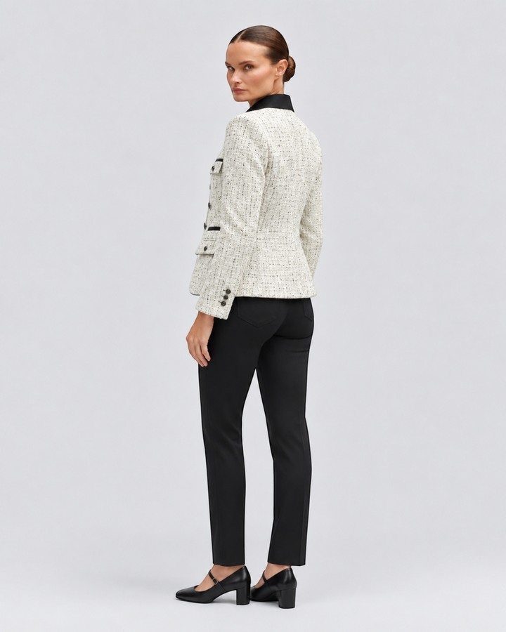 Luna Moda Ida tweed jacket in cream with a black contrast collar and button details, worn by a model from behind.