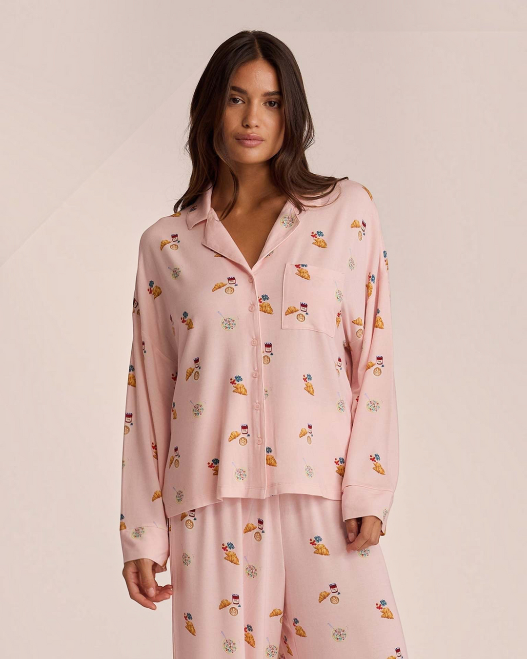 Luna Moda pink button-up pajama set with breakfast print, featuring a relaxed shirt and wide-leg trousers.