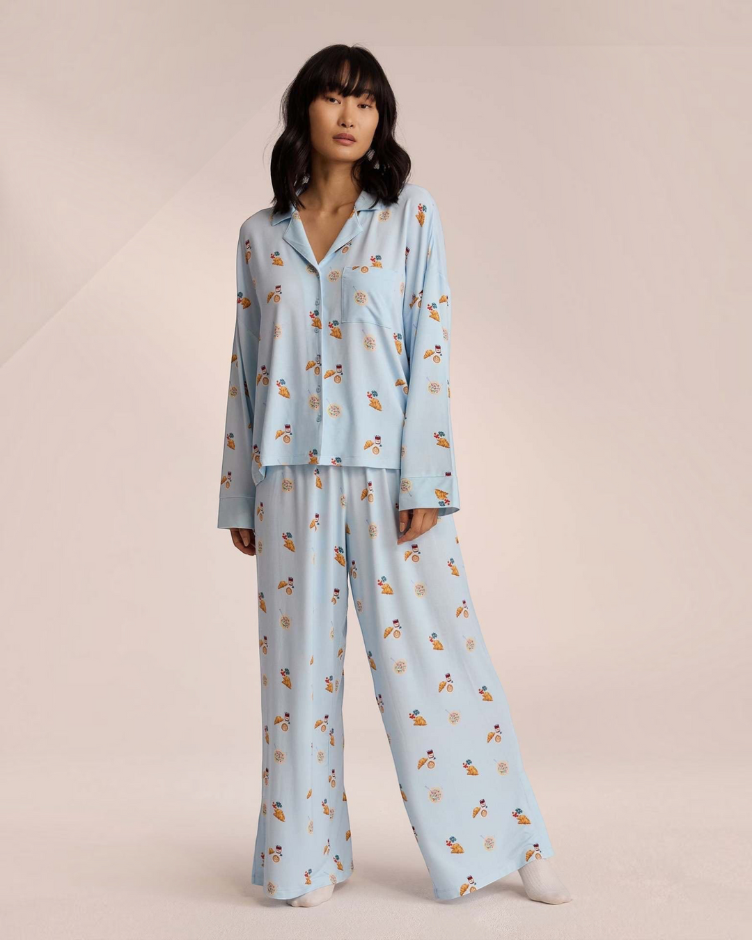Luna Moda light blue button-up pajama set with breakfast print, featuring a relaxed shirt and wide-leg trousers.