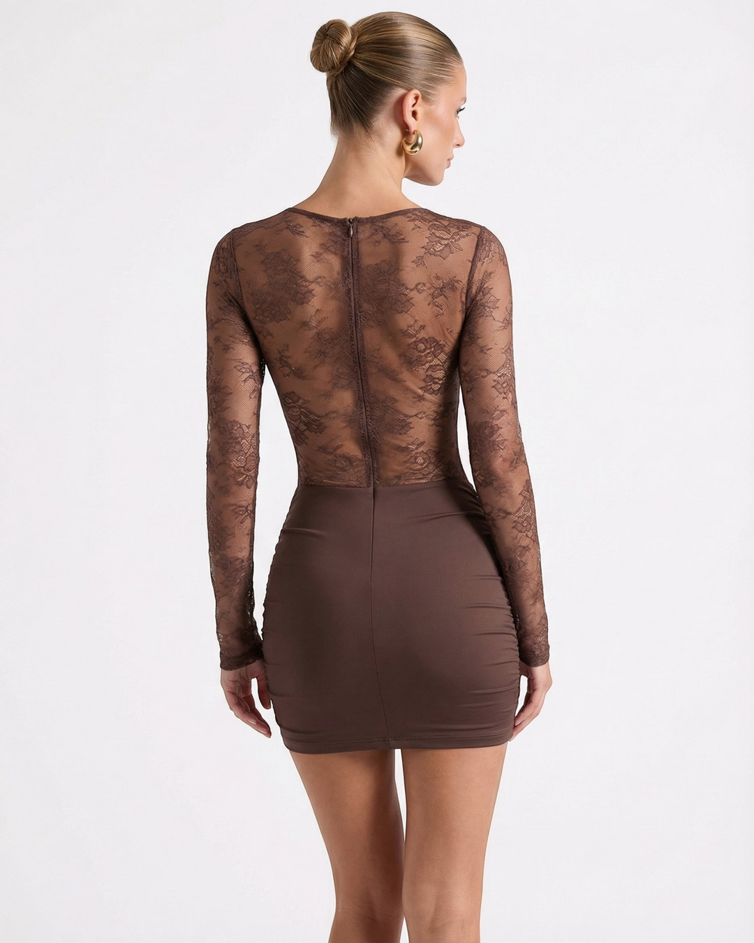Luna Moda brown mini dress with long lace sleeves and a sheer bodice, back view on a model with a hair bun.