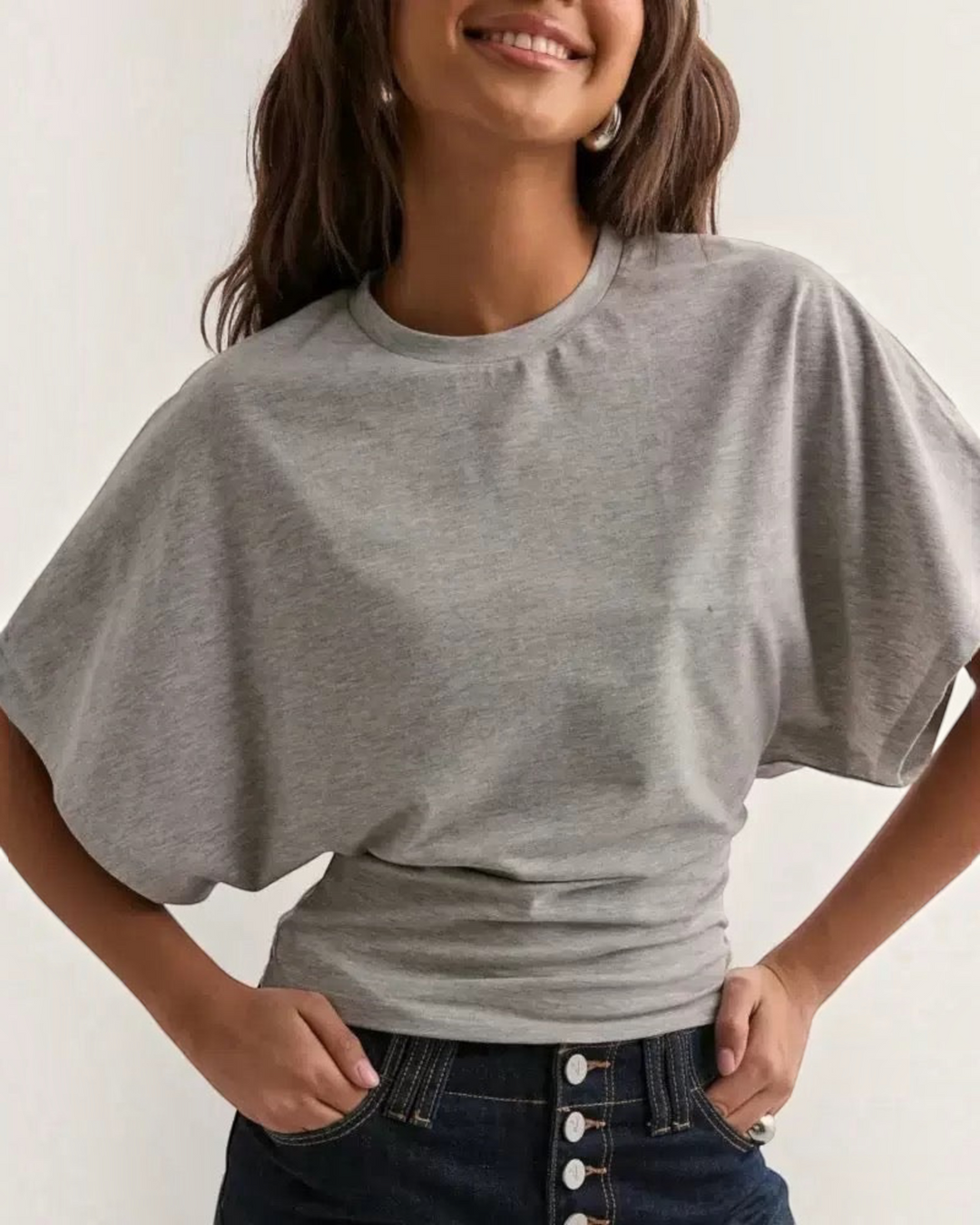 Luna Moda grey relaxed fit t-shirt with wide sleeves and a cinched waist worn by a woman with dark hair