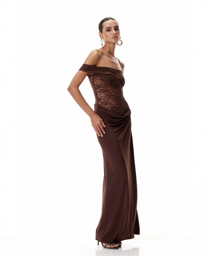 Luna Moda brown one-shoulder maxi dress with a semi-sheer lace bodice, draped skirt, and high thigh slit.