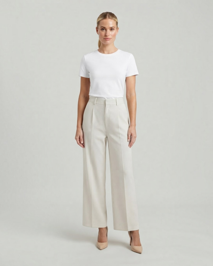 Luna Moda high-waisted beige palazzo trousers with a fluid pleated design worn with a white t-shirt and heels