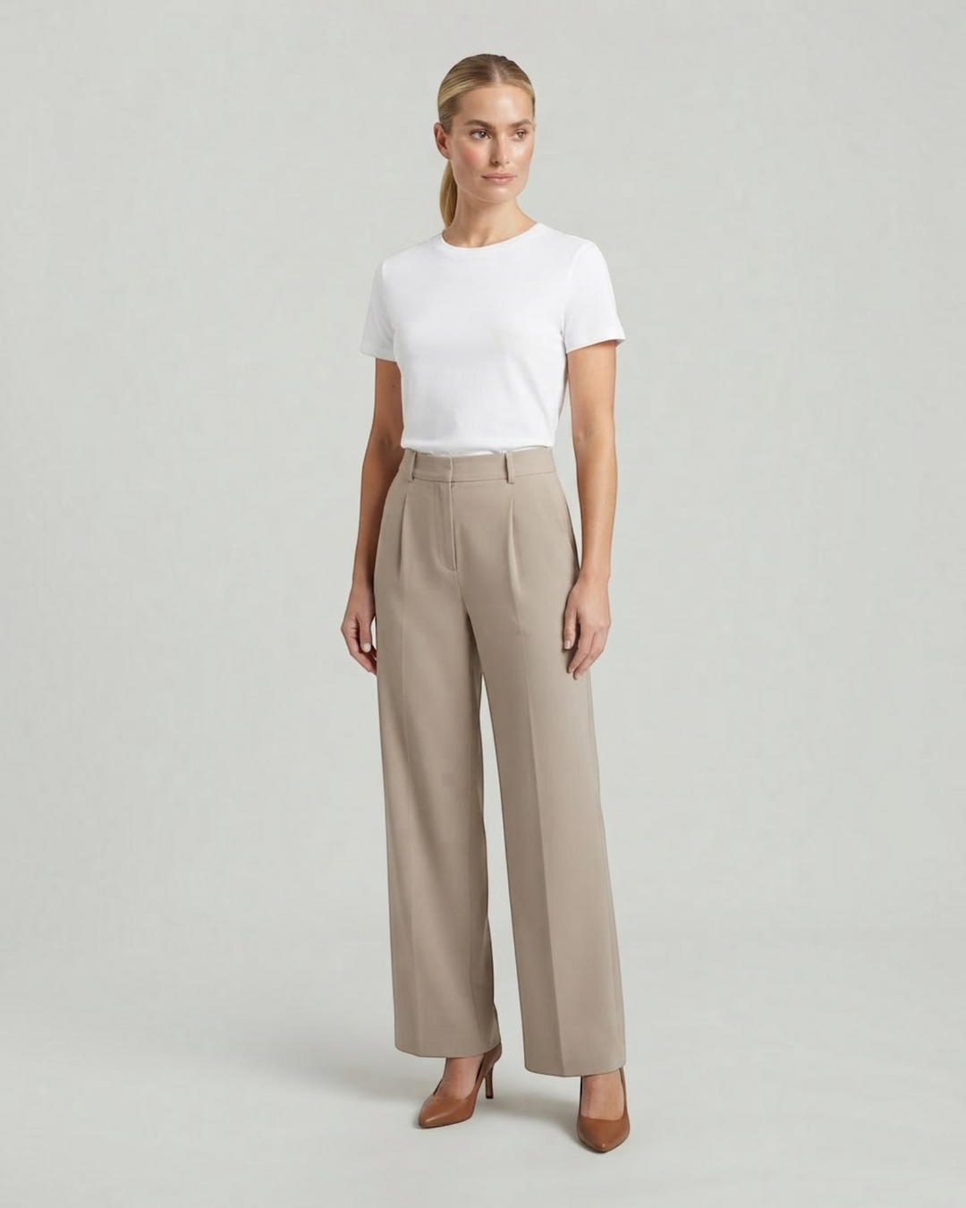 Luna Moda high-waisted beige palazzo trousers with a tailored fit worn by a model with a white t-shirt and heels.