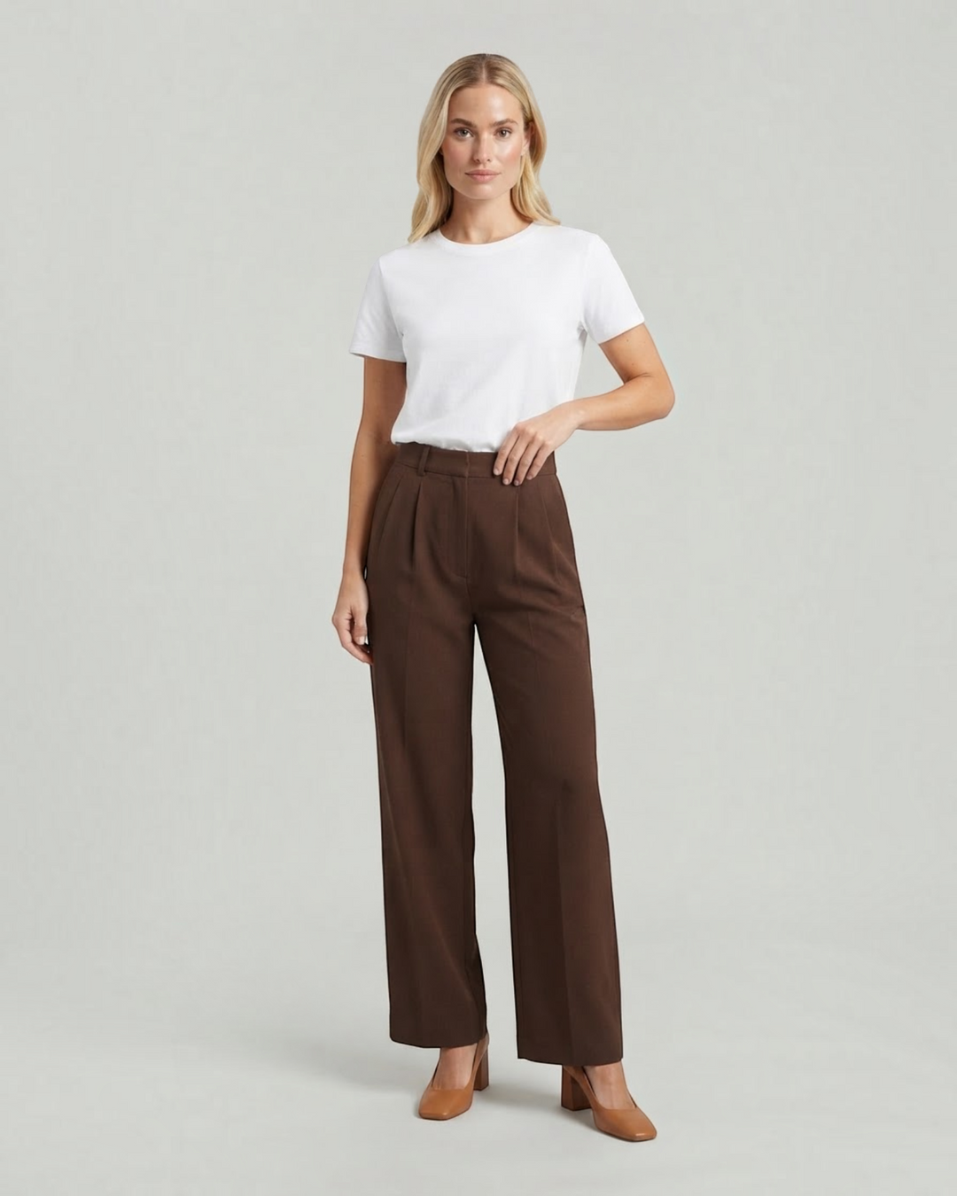 Model wearing Luna Moda high-waisted brown palazzo trousers with a white t-shirt and brown block heels