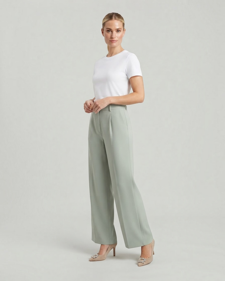 Model wearing Luna Moda high-waisted sage green palazzo trousers with a white t-shirt and beige heels