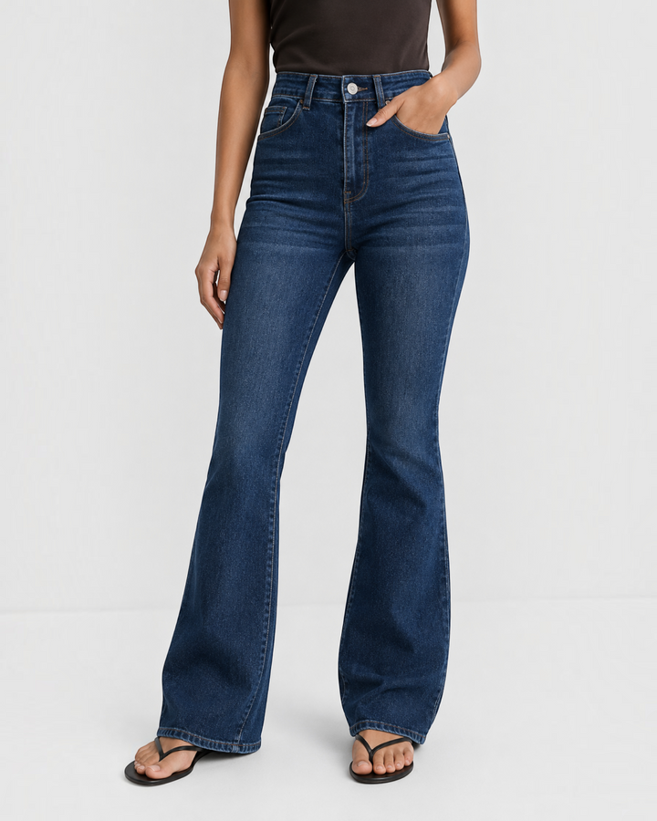 Luna Moda high-waisted dark blue flared jeans in stretchy denim, worn by a model for a flattering silhouette.