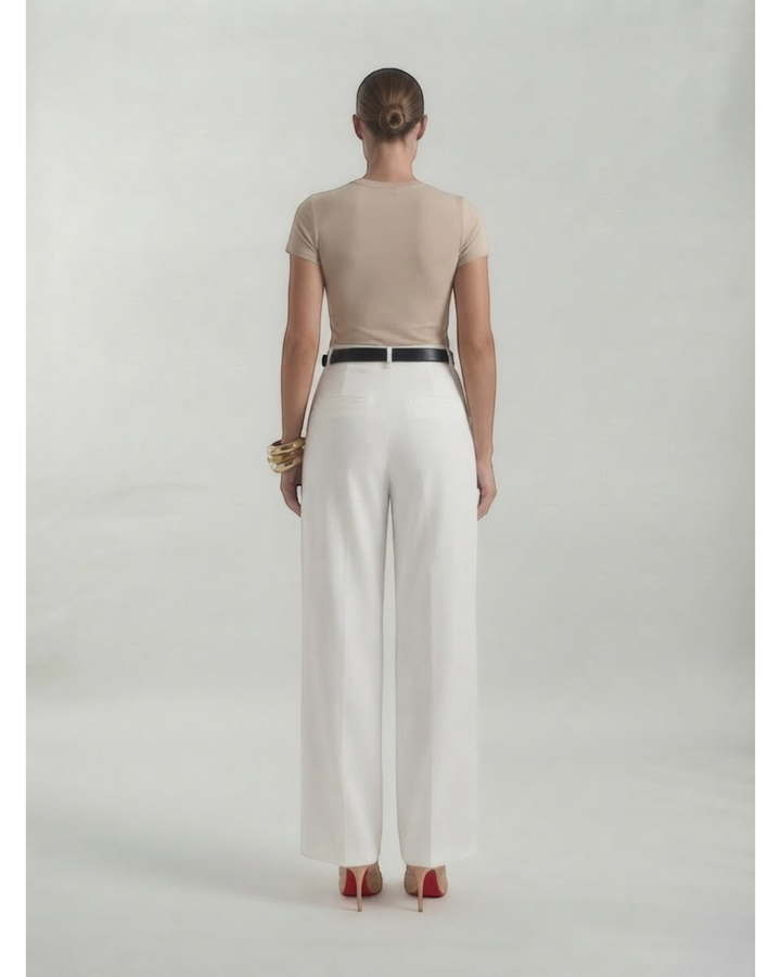 Luna Moda Lorenza white high-waisted wide-leg trousers viewed from the back, paired with a beige top and red heels.