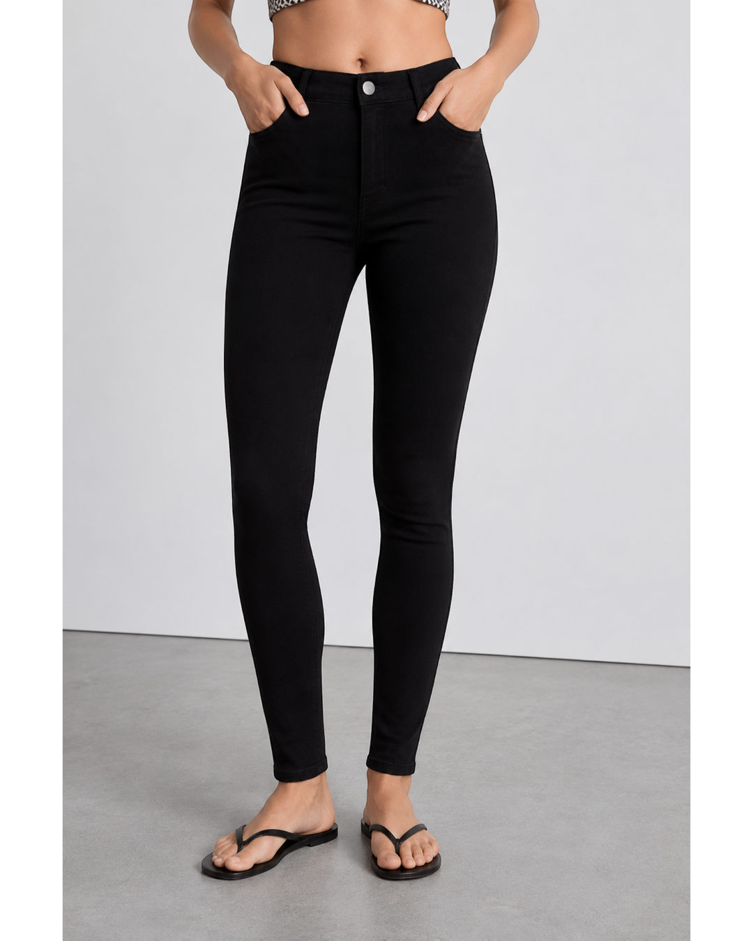 Luna Moda high-waisted black skinny jeans with a sculpting, stretchy fit worn by a model.